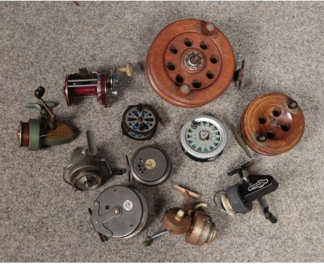 A box of vintage fishing reels. Includes The Gnat, Edgar Sealey, Intrepid, wooden examples etc.  