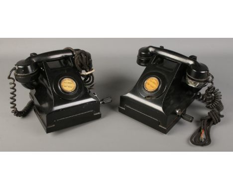 Two vintage hand crank telephones.  