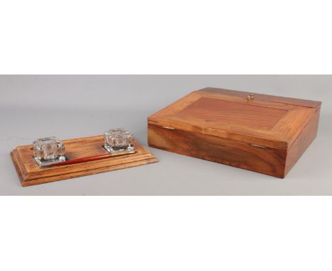 A two-inkwell oak desk tidy, together with a modern hinged-fronted writing slope.  Replacement inkwells to desk tidy.