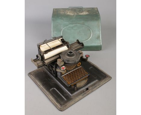A vintage German child's tinplate typewriter.  