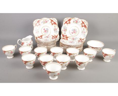 A quantity of Tuscan china ceramics in the Windsor design. Including cups &amp; saucers, side plates, sugar bowl, milk jug, e