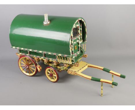 A painted wood Romany wagon model with detachable ladder.  