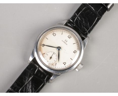 A Gents steel cased Omega manual wind wristwatch, reference 2165, with silvered dial, even numeral markers and seconds dial. 