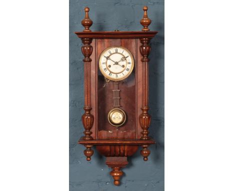 A Vienna wall clock, with crossed arrow dial for Hamburg American Clock Company. Turned finials to the top and bottom. Comple