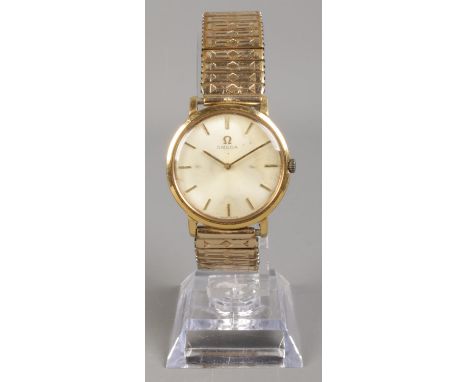 A Gent's gold plated Omega manual wristwatch, on rolled gold expanding strap. With silvered dial and baton markers.  Not runn