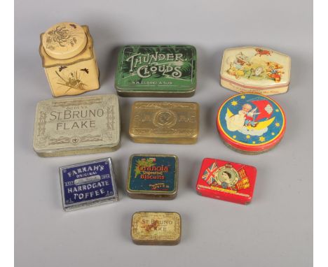 A quantity of vintage tins to include tobacco, toffee and commemorative examples.  