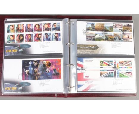 An album of Royal Mail first day covers. Including James Bond, Queen, Rolling Stones, DC Collection, etc.  