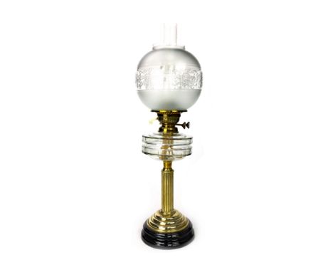 LATE VICTORIAN OIL LAMP, with faceted glass reservoir above a fluted column and stepped base, clear glass chimney and frosted