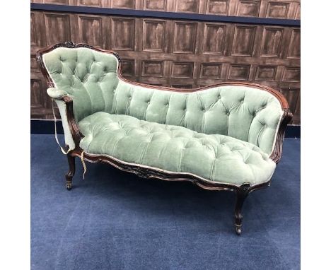 VICTORIAN ROSEWOOD CHAISE LONGUE, of rococo design, with floral carved and moulded top rail, upholstered button back and seat