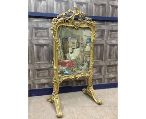 VICTORIAN GILTWOOD AND PLASTER FIRESCREEN, of rococo design, with ornate floral and pierced scroll cresting, inset with a nee