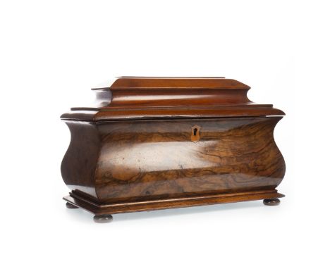 VICTORIAN MAHOGANY AND FIGURED WALNUT BOMBE SARCOPHAGUS TEA CADDY, the hinged cover revealing an interior with three lidded c