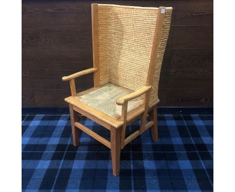 20TH CENTURY LIGHT OAK FRAMED ORKNEY CHAIR, the curved woven straw back flanked by open arm rests, drop-in seat, on square ta