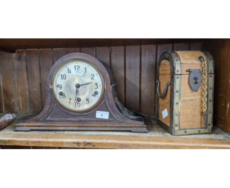 A mantle clock with key and a wooden casketCondition:- General wear to case, not currently in working order, glass door diame