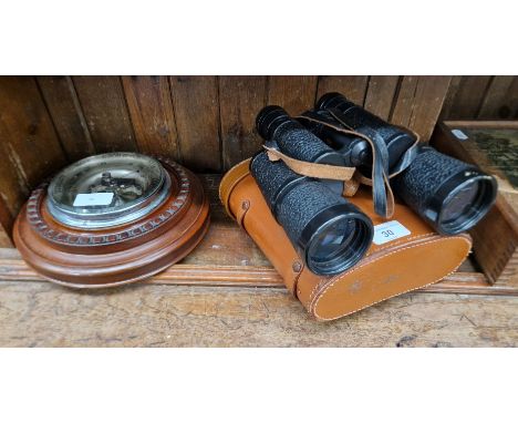 A pair of Russian 7x50 binoculars and a circular barometer  