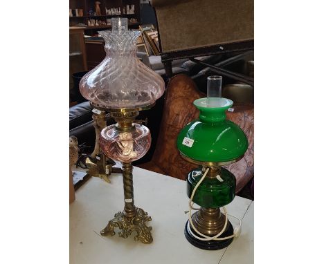 Oil lamp with pink glass bowl and shade, together with another having green bowl and shade, and converted to electric