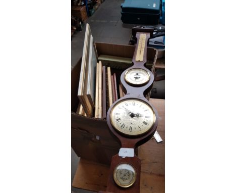 A box of pictures and prints and a barometer.  