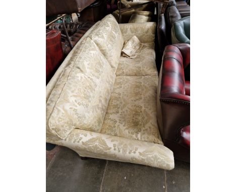 A Duresta three seater sofa upholstered in cream and gold damask.  