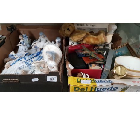 Two boxes of figures and misc items including figurines, camera, desk lamp, blue jasper ware etc