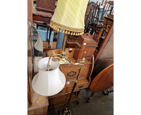 A brass Corinthian column table lamp together with an adjustable brass floor standing lamp  