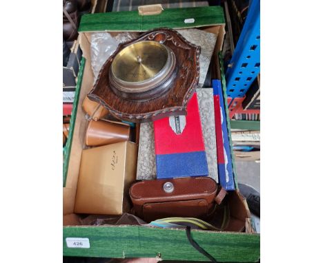 A box of assorted items including cutlery, barometer mounted on oak, and Agfa folding camera, model Billy Records 1