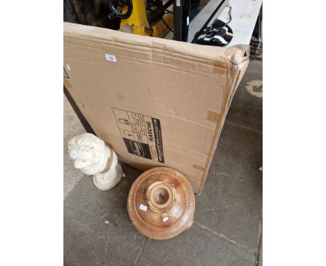 A vintage earthenware water filter and a boxed metal garden gates with arch  