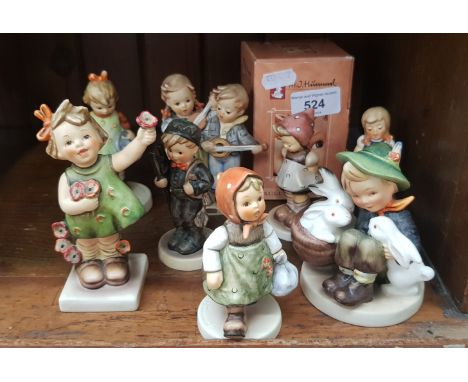 8 Hummel figurines including ‘Playmates’ (1950-55), ‘Happy Days’ (1950-72), a boxed exclusive edition Hummel Club Membership 
