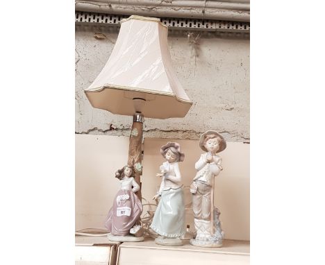 Nao table lamp with shade (overall height 54cm) together with 2 Nao figurines ‘Shepherd with Sparrow’ (209) 27cm high and ‘Gi