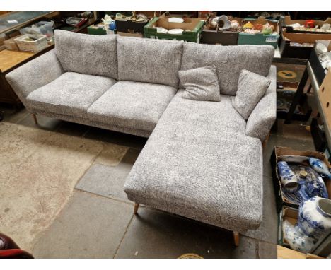 An Ercol 'Forli' corner sofa/chaise upholstered in grey fabric with light oak legs, height 85cm, width 261cm and depth 160cm.