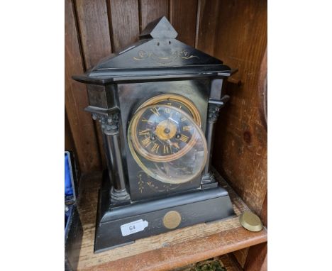 A black slate mantle clock, presentation inscription dated 1883