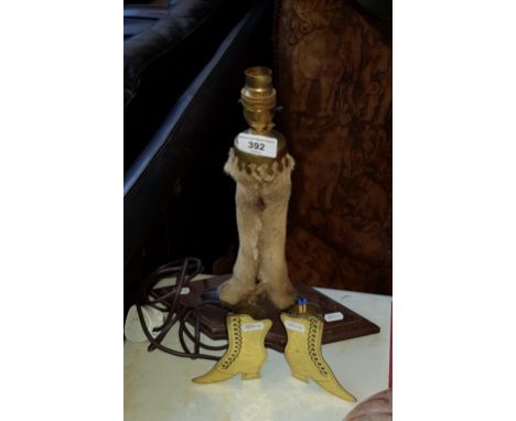 A taxidermy twin deer foot lamp together with a pair of brass vases/match holders modelled as boots.  