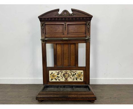 VICTORIAN OAK STICK STAND, with metal fittings and tiled back105cm high, 65cm wide
