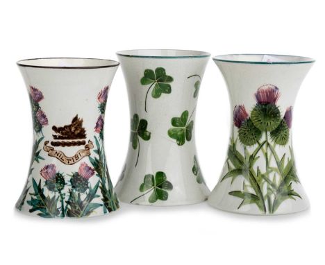 WEMYSS, THREE BEAKER VASES, each hand painted, one decorated with thistles, with hogs head armorial reading "NIL TIBI", with 