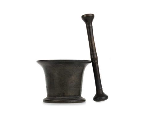 BRONZE MORTAR AND PESTLE, 19TH CENTURY of tapered form, on a stepped base8.9cm high