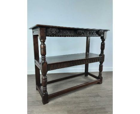 OAK BUFFET, of Carolean design, with two tiers, each with carved frieze, on turned supports93cm high, 113cm wide