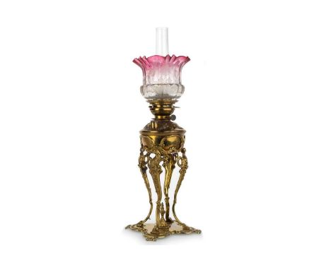VICTORIAN BRASS OIL LAMP, LATE 19TH CENTURY with clear glass chimney and etched cranberry to clear glass shade, embossed pate