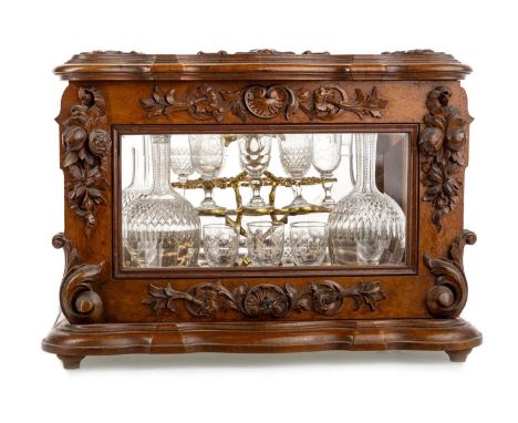 VICTORIAN GLAZED MAHOGANY DECANTER BOX, LATE 19TH CENTURY of serpentine oblong form, carved and moulded with scrolls, husks a