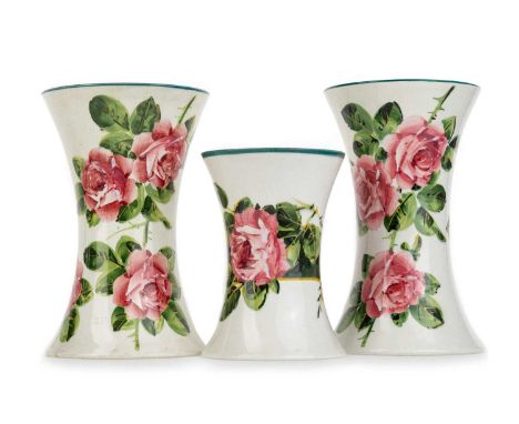 WEMYSS, THREE BEAKER VASES, each hand painted with roses, with impressed marks, one with stamped retailer mark for T.Goode &a