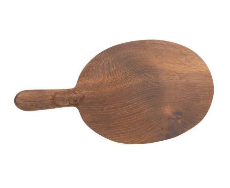 ROBERT ‘MOUSEMAN’ THOMPSON (1876-1955) OF KILBURN, ADZED OAK CHEESEBOARD, of oval form, with a carved mouse signature40cm lon
