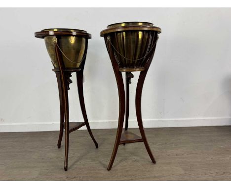 TWO EDWARDIAN MAHOGANY PLANTER STANDS, each with sheraton panel and brass insertslargest 93.5cm highQty: 2This lots included 