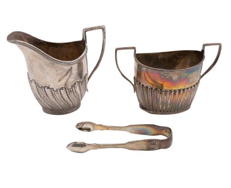 A George V silver cream jug, Charles Stuart Harris, London 1902, of part swirl fluted form, together with a similar sugar bas