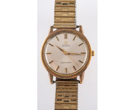 Omega a gentleman's gold wristwatch the champagne dial with raised gold and black baton numerals, a sweep seconds hand, bague