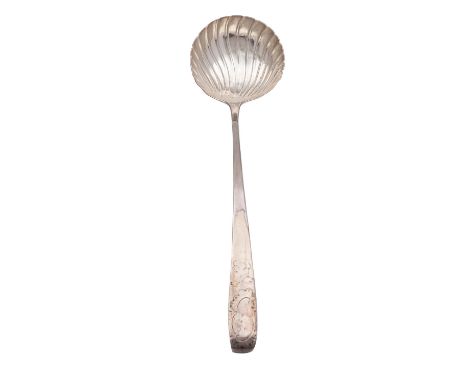 A George III Irish silver shell bowl serving ladle, maker's mark John Locker, Dublin 1769, Old English pattern, engraved Roco