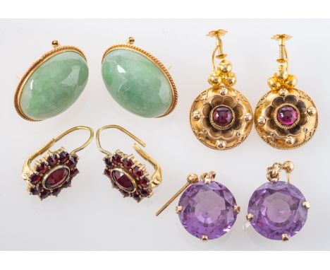 Four pairs of earrings, including a pair of jade ear studs, stamped '14K'; a pair of foil backed garnet drop earrings, stampe