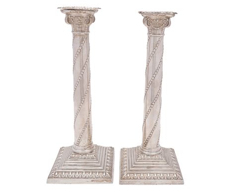 A pair of George V silver Corinthian column candlesticks, maker William Hutton and Son Ltd, London 1897, the detachable scone