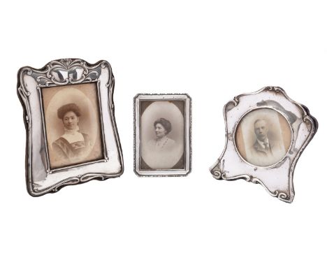 An Art Nouveau silver photograph frame, Joseph & Richard Griffin, Chester 1906, of rectangular form, together with two other 