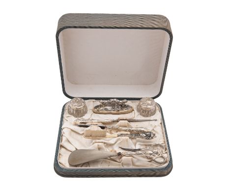 An early 20th century American Art Nouveau silver lady's dressing table set, stamped Sterling, silver filed handles, comprisi