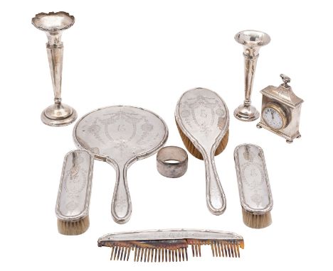 An early 20th Century silver dressing table timepiece, Chester, other marks rubbed out, together with two silver vases, a nap