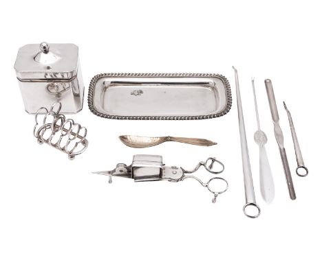 A 19th century Sheffield Plate tea caddy of canted rectangular form, together with a candle snuffers and tray, a pair of bott