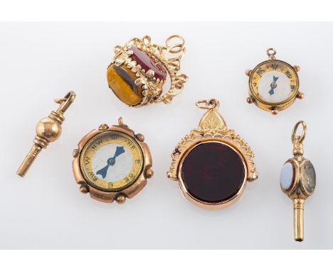 A small collection of miscellany, including two 9ct gold, swivel seal fobs, a 9ct gold compass, a second compass and two watc