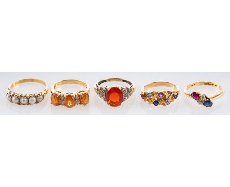 Five gemset rings, including an 18ct gold, sapphire, ruby and diamond cross-over ring; a 9ct gold fire opal and diamond ring;